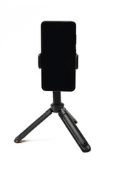 Smartphone on tripod stand isolated on white background