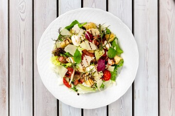 plate of fresh tasty healthy salad with vegetables
