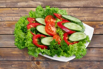 plate of fresh tasty healthy salad with vegetables