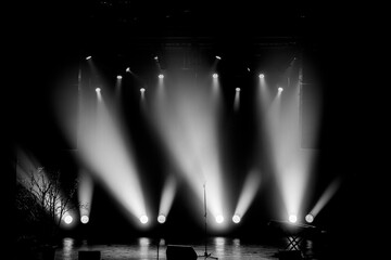 Empty stage lit up in lights, black and white image