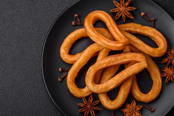 Delicious sweet churos with powdered sugar and cream inside