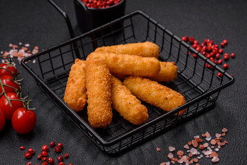 Delicious crispy cheese sticks with mozzarella, salt and spices, breaded