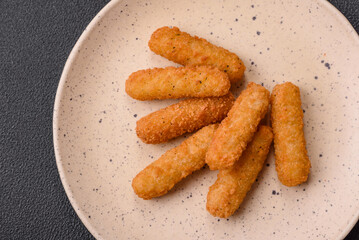 Delicious crispy cheese sticks with mozzarella, salt and spices, breaded