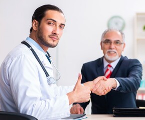 Male doctor and businessman discussing medical project