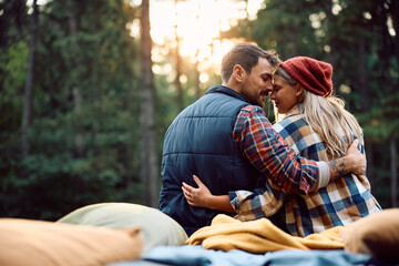 Romantic couple in love on camping in nature during autumn.