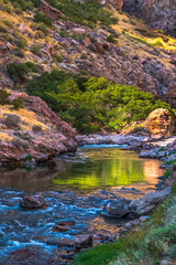Naklejka premium Reflections in the Arkansas River with a background of rock walls in Royal Gorge in Colorado
