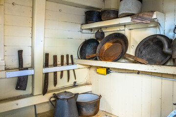 Kitchen tools in a sailing ship galley in Massachusetts - obrazy, fototapety, plakaty