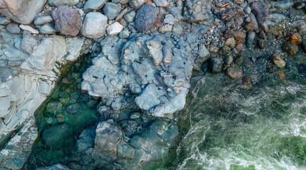 Rocks by the river in Canadian Nature Landscape. Background.