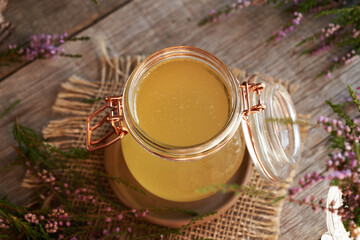 Heather syrup in a glass jar