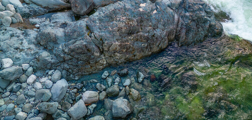Rocks by the river in Canadian Nature Landscape. Background.
