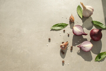 Gray cooking background with spices oil and other kitchen tools