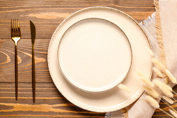 Table setting with spikelets on wooden background