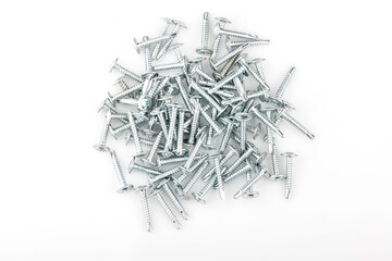 Zinc screws with a round press washer on a white background. Detailed shot of fittings and fasteners.