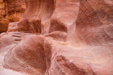 Fototapeta premium Kayon Sik. A close-up view of the winding road and undulating canyon walls. Petra Jordan