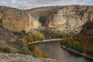 View into the canyon of River Duraton during autumn time in Hoces del Duraton natural park near...