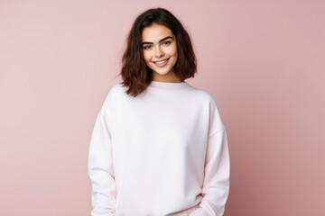 Obraz premium lady in white mockup sweater, standing in pink studio background