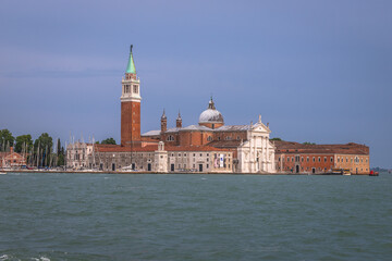 Fototapeta premium Exposure Exposure of the Gondolas in Venice with the Abbazia in the background, on a sunshiny day showing the pretty views of this magnificent city.