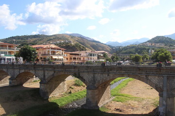 Fototapeta na wymiar view of the town of Diamante, Cosenza, Calabria, Italy with famous bridge over the river that flows into the sea