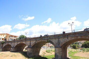 
view of the town of Diamante, Cosenza, Calabria, Italy with famous bridge over the river that flows into the sea