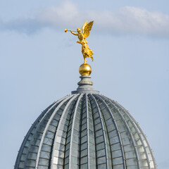Fototapeta na wymiar Golden angle statue on top of the art academy Dresden, Saxony, Germany