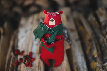 Christmas, New Year, Winter concept. Christmas toy bear on wooden logs