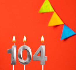 Birthday candle number 104 - Invitation card in orange background