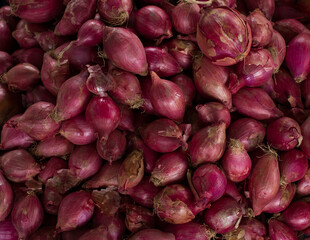 Photograph of a group of onions in a South American market. Fruit concept.