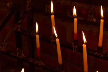 Photograph of lit candles. Concept of religions and beliefs.