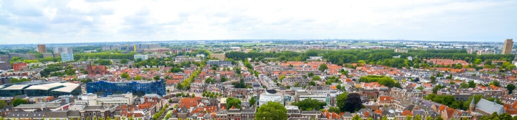 Fototapeta na wymiar Panoramic view of Amsterdam skyline, rooftops, city life, no people