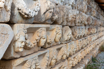 Closeup of architectural details of ancient stone carved frieze of Portico of Tiberius in Aphrodisias, Caria, Turkey