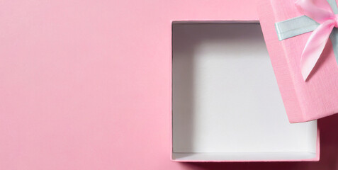 blank pink pastel color present box or open gift box with pink ribbon and bow isolated on pi - obrazy, fototapety, plakaty