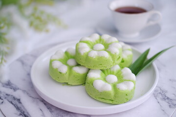 Kue Putu Ayu, a traditional Indonesian snack made from rice flour, pandan leaves, grated coconut then steamed.