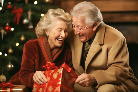 SENIOR COUPLE OPENING CHRISTMAS PRESENTS