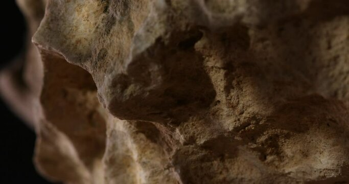 Rock Stone texture close-up. Rought mountain surface. Geological sample. Wall in cave. Macro shot natural mineral background. 