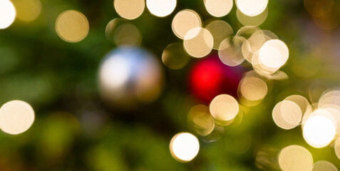 christmas blurred bokehl lights background with a variety of lights and trees lights apear t 