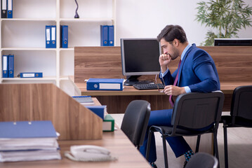 Young male employee working in the office