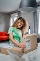 one happy woman open mail cardboard package box present at home