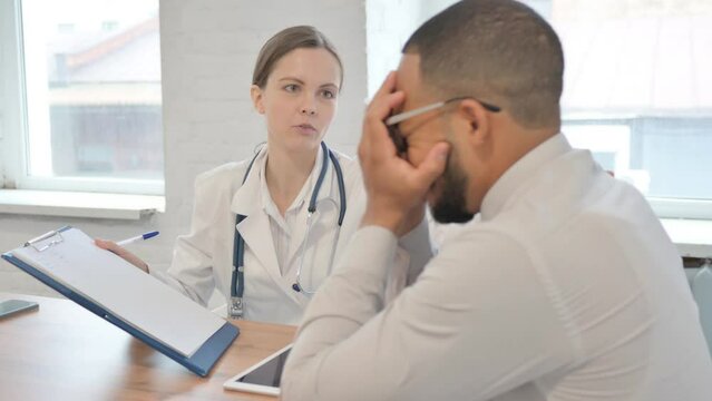 Patient Reacting to Bad Medical Reports in front of Female Doctor
