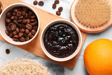 Flat lay composition with natural body scrub and fresh ingredients on white marble table. Anti cellulite treatment