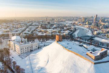 Beautiful sunny Vilnius city scene in winter. Aerial early evening view. Winter city scenery in Lithuania. - obrazy, fototapety, plakaty
