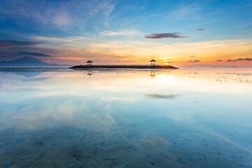 Karang beach, Sanur sunrise in Bali, Indonesia. View of two pagoda at the beach low tide. - 664706856