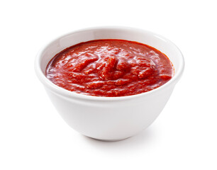 Tomato sauce in a bowl on a white background. - obrazy, fototapety, plakaty