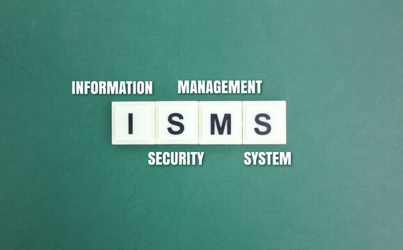wooden cube with the letters ISMS or the word Information Security Management System. safety management concept