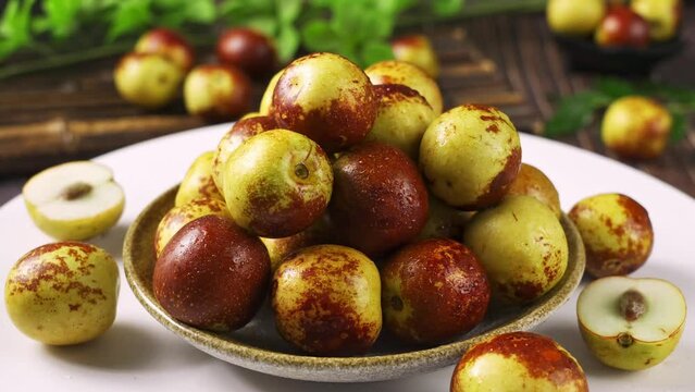 Fresh ripe Chinese jujubes fruits on table.