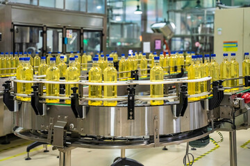 Cooking oil or Sunflower oil in the bottle moving on production line, factory in Ho Chi Minh city, Vietnam