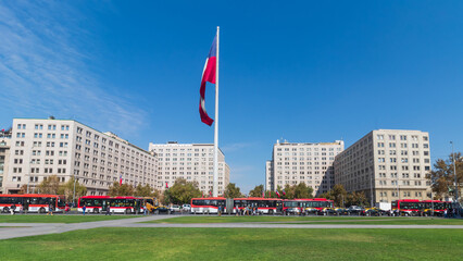 blue sky and the Chilean flag in the wind in Citizenship Square, Santiago, Chile
