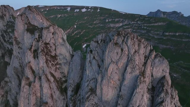 Drone shot the rocky peak of the Altmann Mountain on the Alpstein Appenzell at sunrise, Switzerland