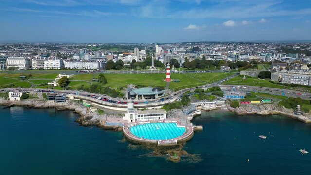 Aerial footage of Hoe Park and the cityscape of Plymouth on a sunny day, England