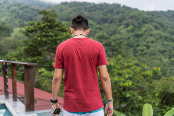 Man on his back with the mountain in the background