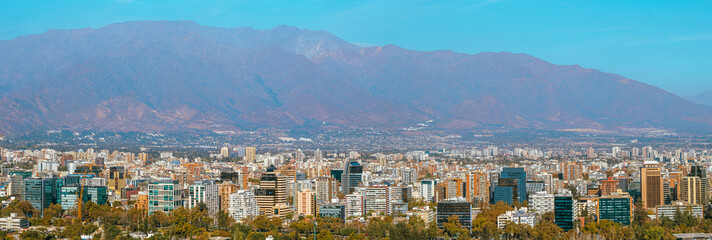 panorama of the city of Santiago Chile with its buildings,   and the Andes mountain range